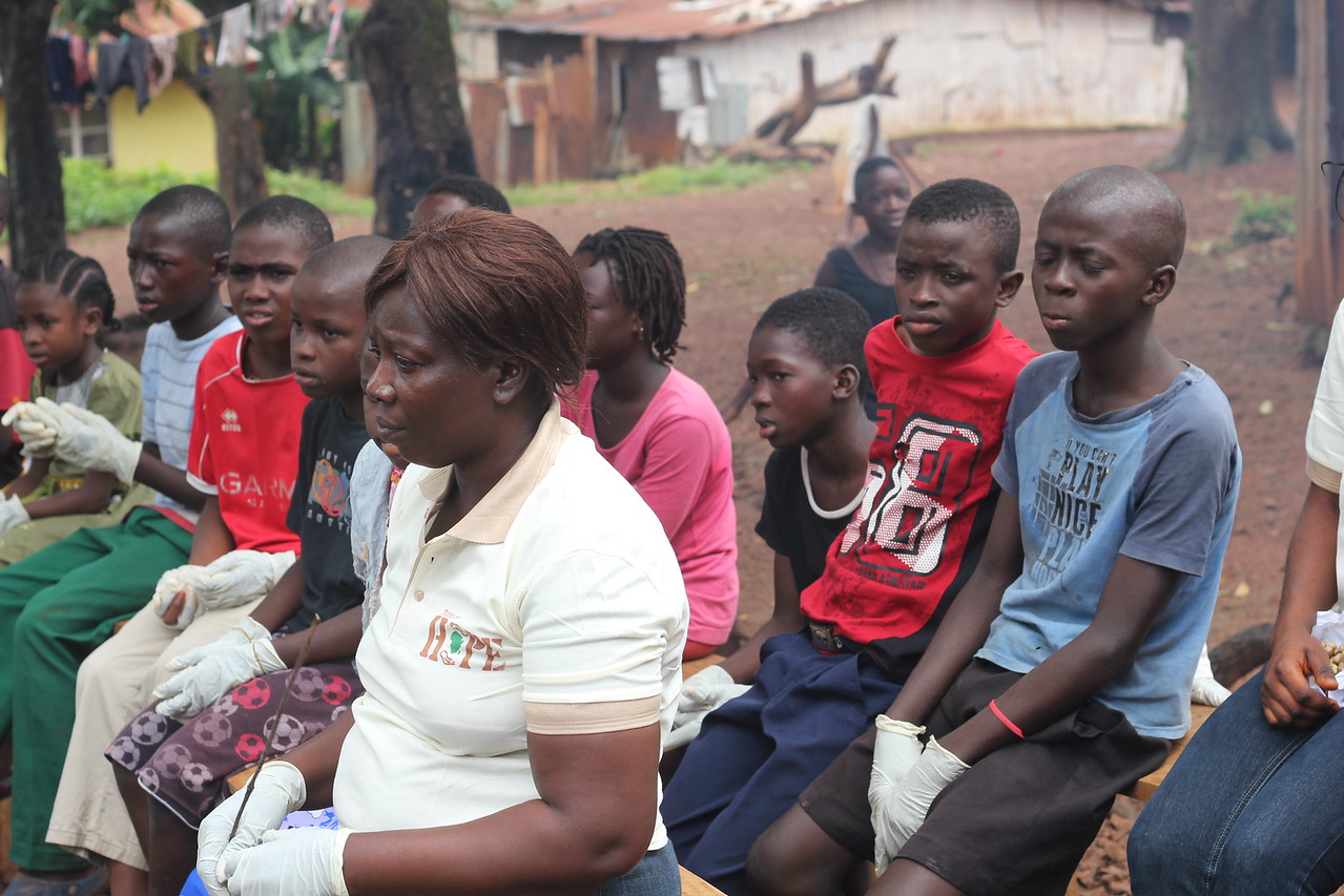 Adults and kids at an Ebola sensitization program
